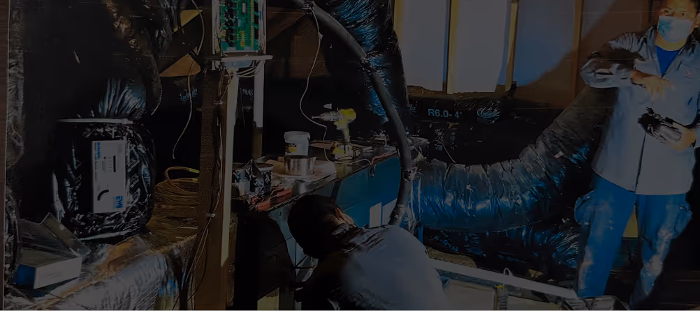 Technical workspace with electronic components, wires, and protective materials