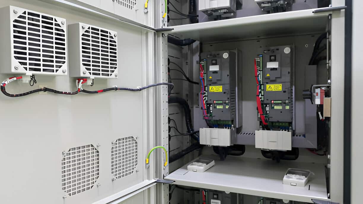 Electrical control cabinet with ventilation fans and industrial switchgear