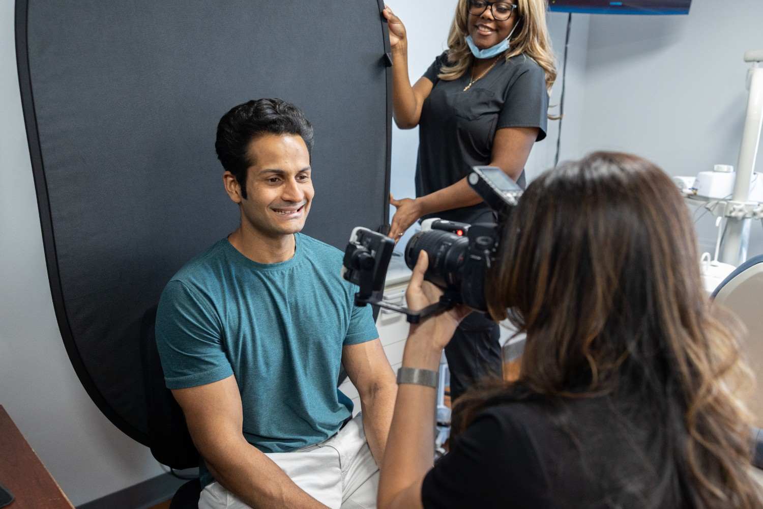 Dental patient posing for a professional photo during a dental office photoshoot