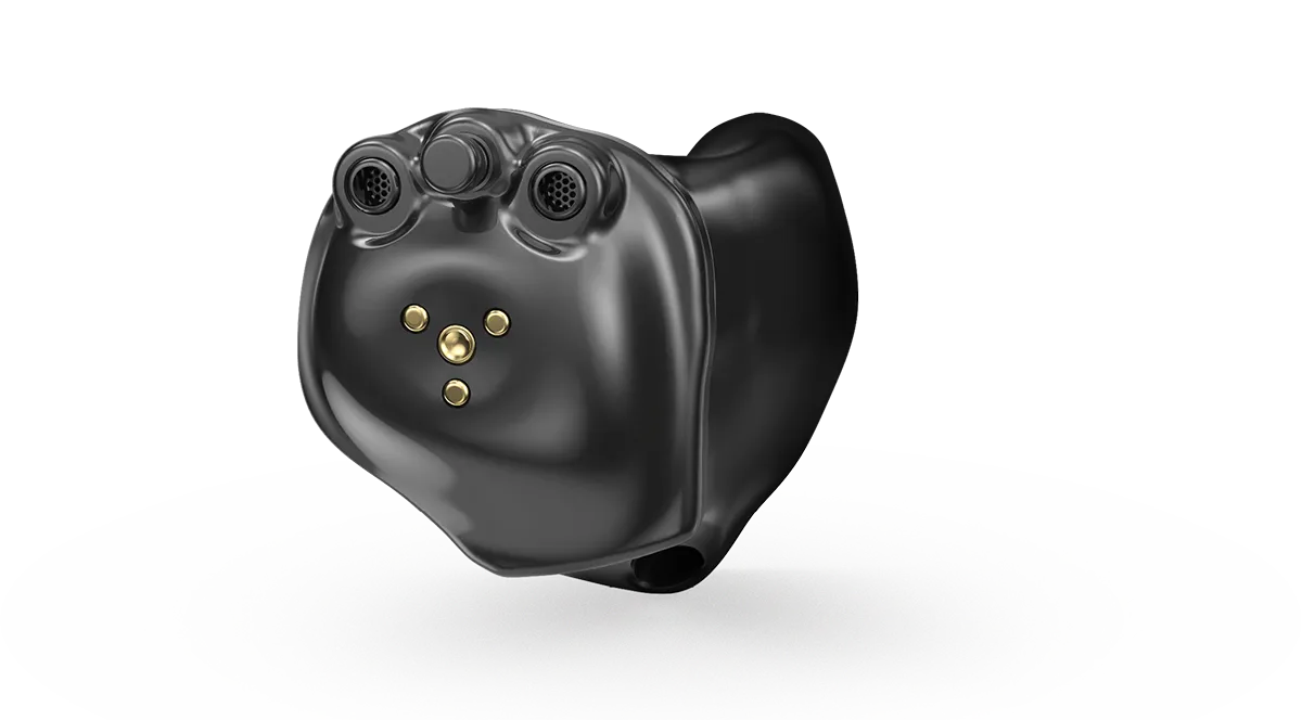 Close-up of black custom hearing aid with multiple microphones