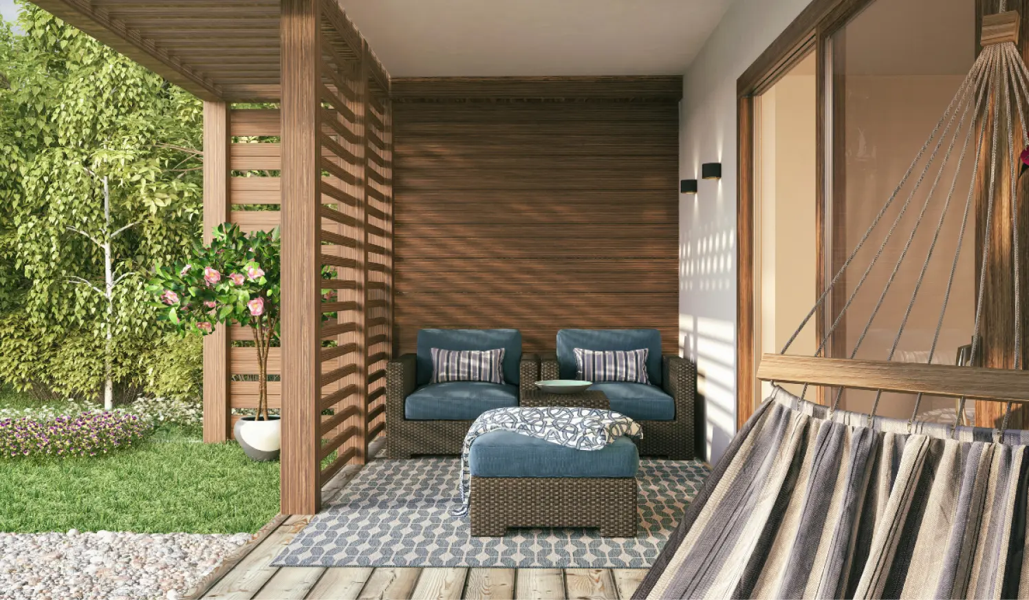 Utendørs terrasse med gress og steinbelagt område, designet og bygget av Perfekt Hus & Hage for et harmonisk og funksjonelt uterom.