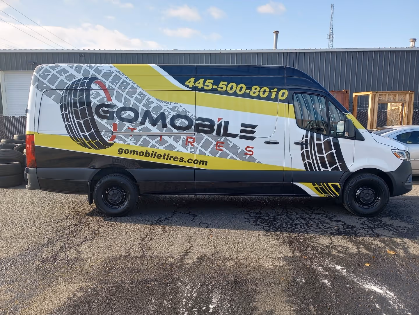 A van parked in front of a building.