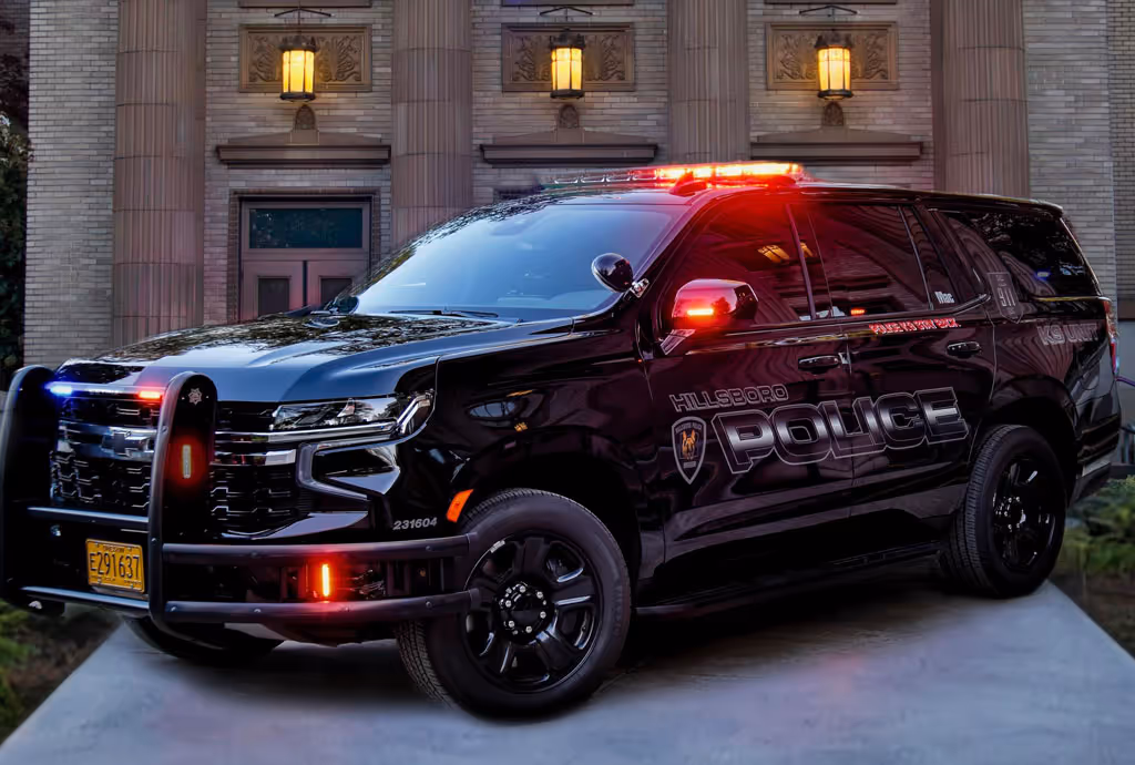 A police car parked in front of a building.