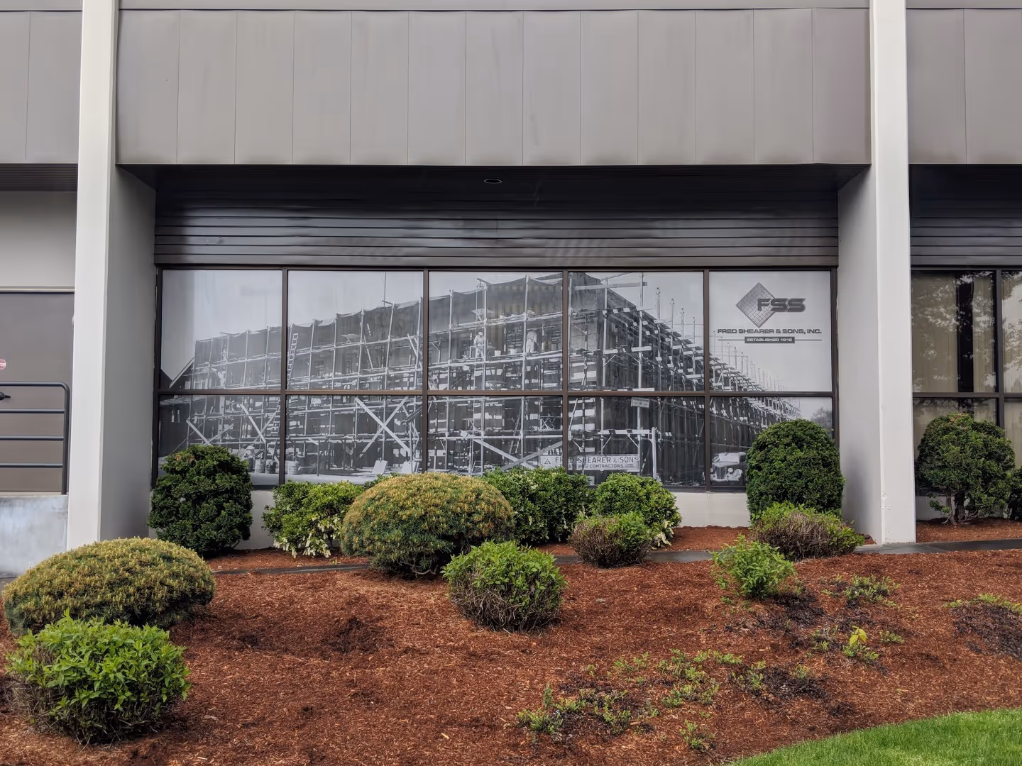 A picture of a building with a lot of windows.