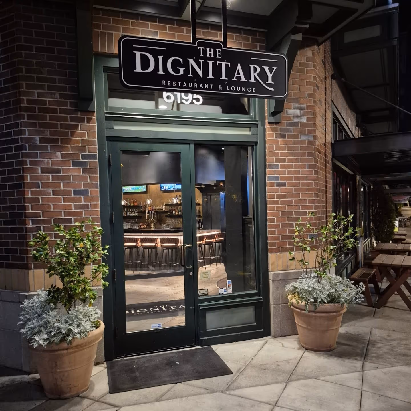 A building with a sign that says the dignitary.