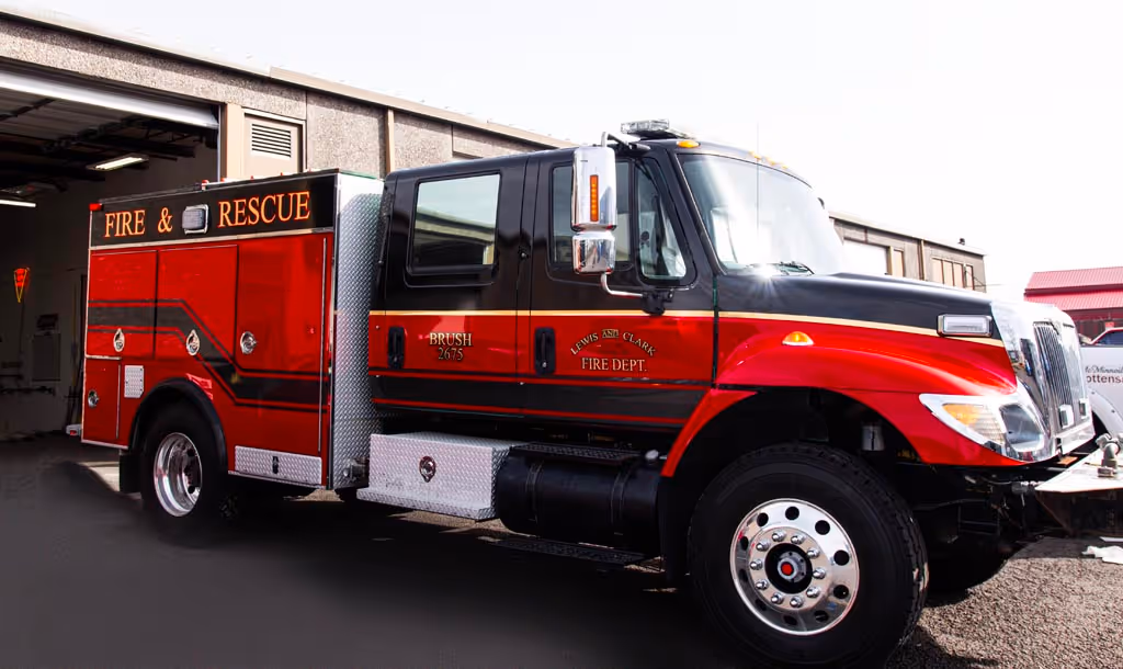 A fire and rescue truck parked in a garage.