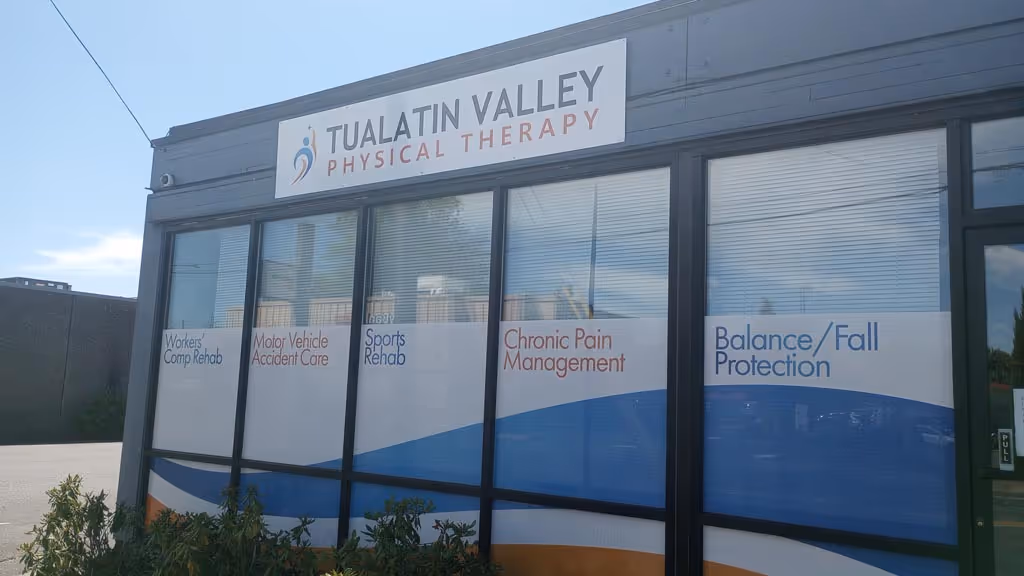 A sign on the side of a building that says italian valley physical therapy.
