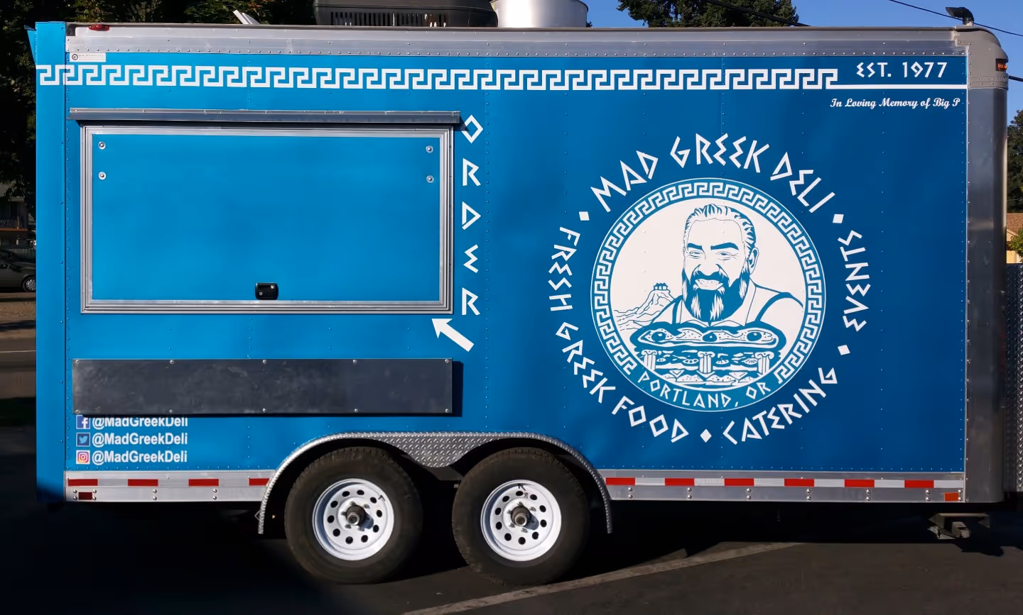 A blue trailer with a picture of a man on it.