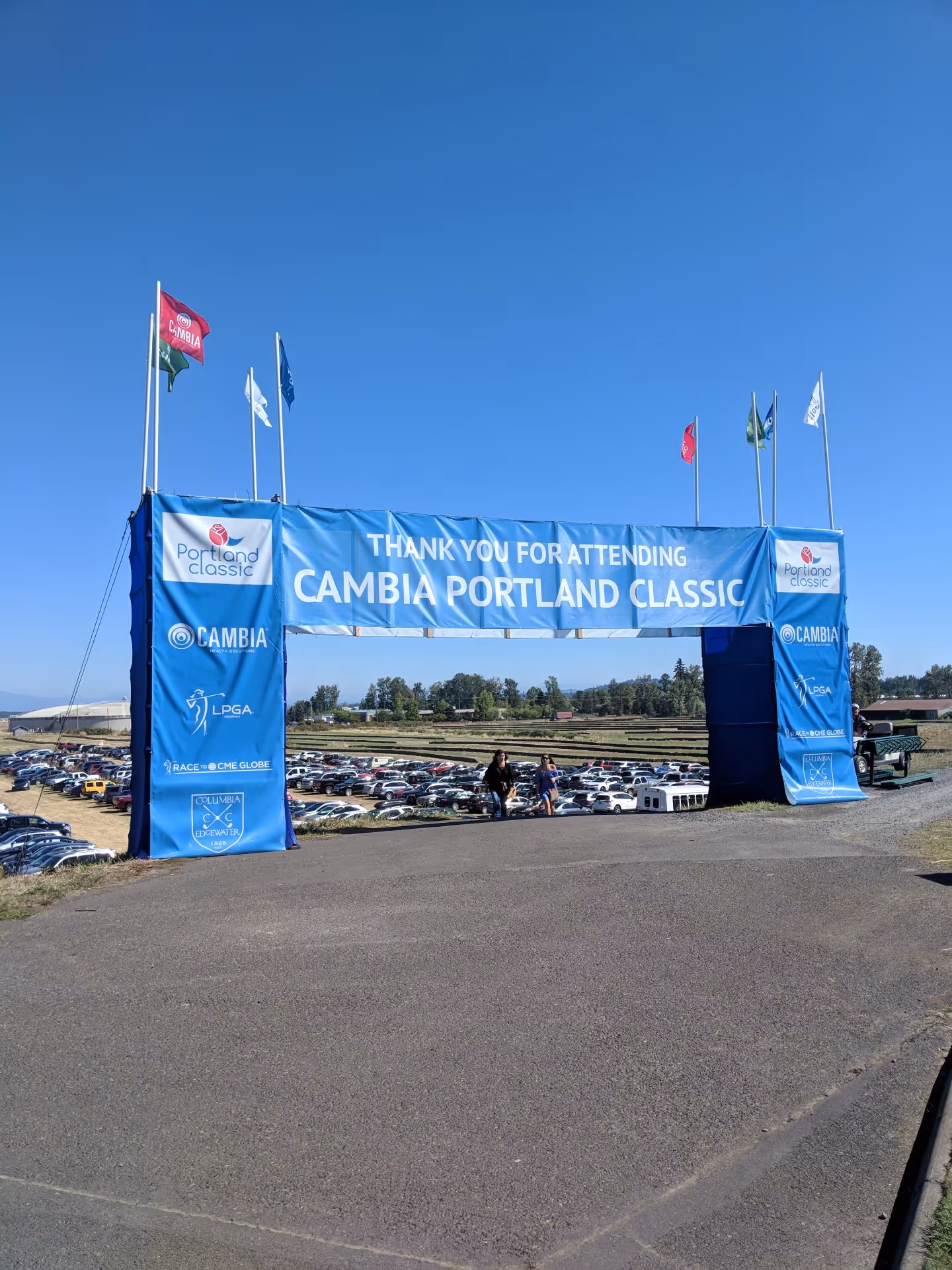 A large blue banner on the side of a road.