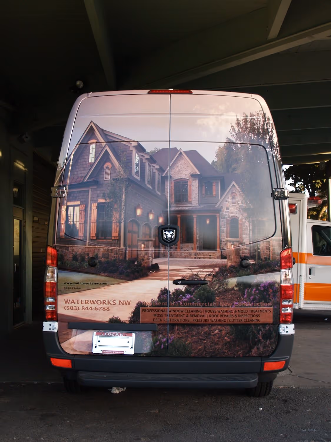 A van is parked in front of a house.