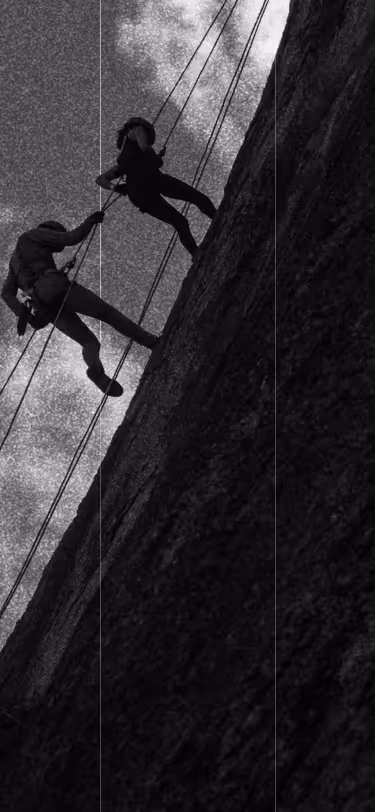 People rock climbing