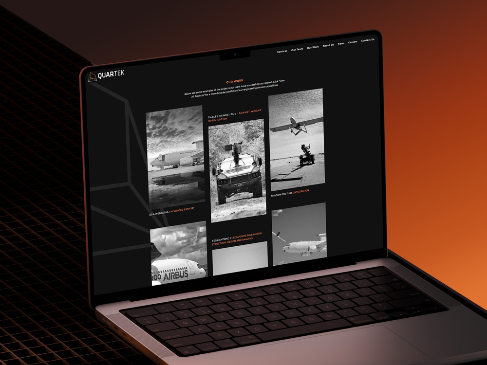 Quartek website mockup on Macbook
