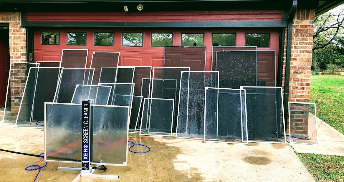 Clean window screens arranged outside a home