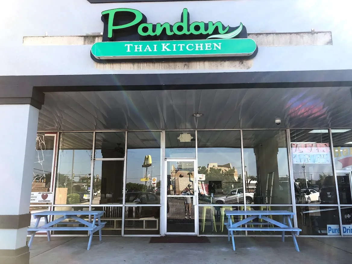 Exterior of Panda Thai Kitchen with covered entrance and outdoor seating