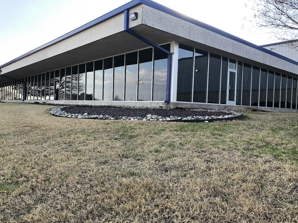 Single-story commercial office building with large exterior windows