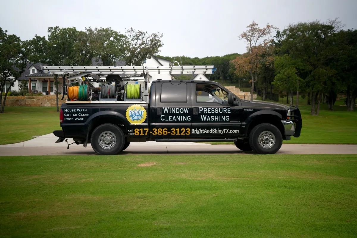 Bright & Shiny pressure-washing truck parked on a lawn