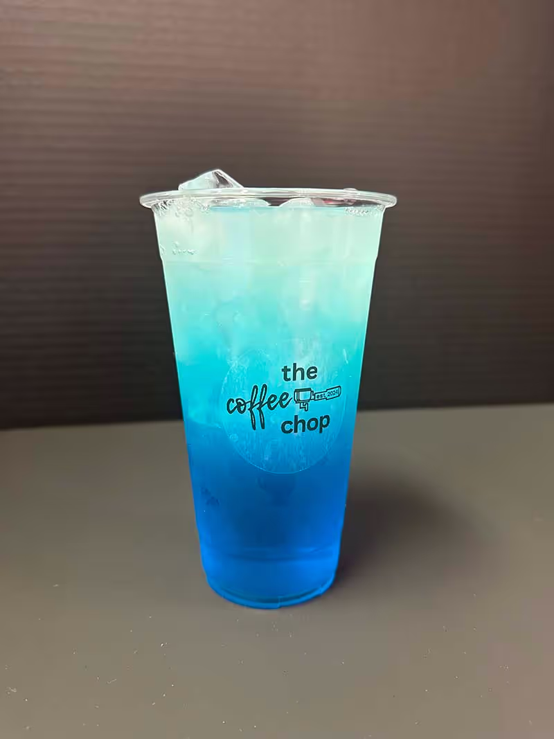 A blue coffee drink in a cup.