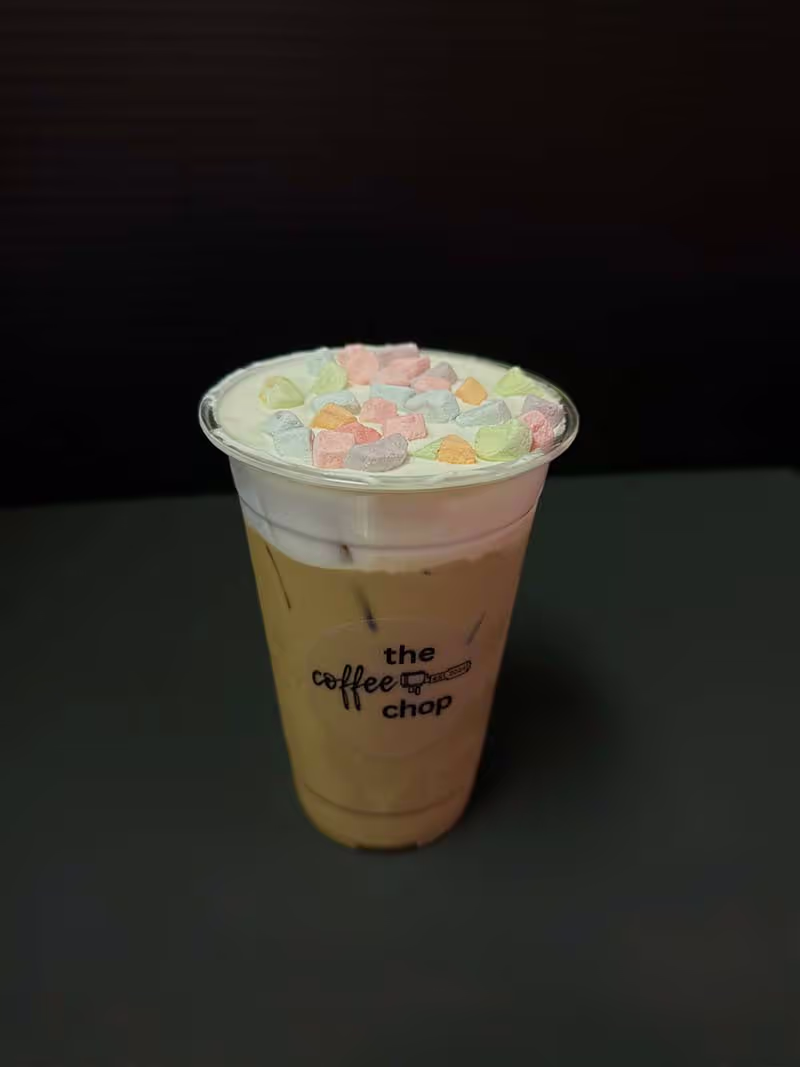 A cup of coffee with a logo on the side.