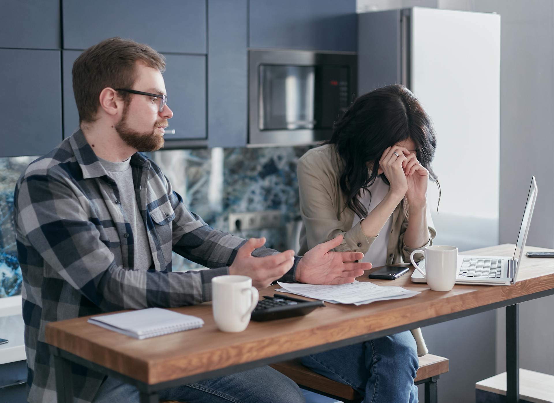 Two worried man in front of laptop