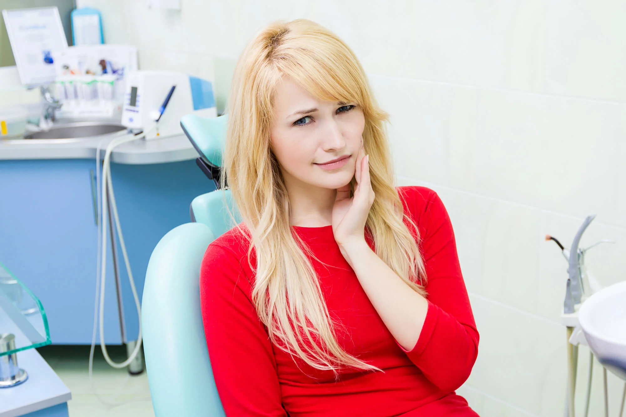 Patient experiencing tooth pain before tooth extraction in Fort Worth