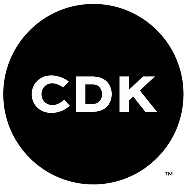 CDK logo with white letters on a black circular background.