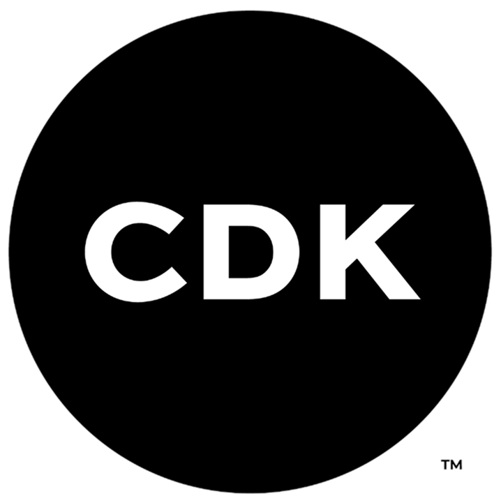 CDK logo with white letters on a black circular background.