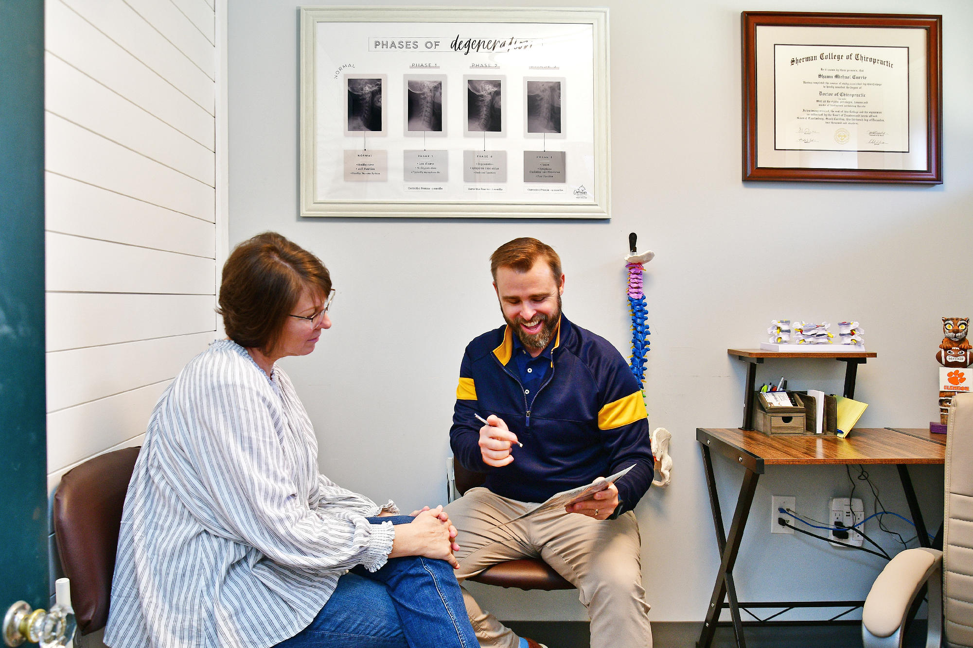 Dr. Shawn Currie talking with a paitent