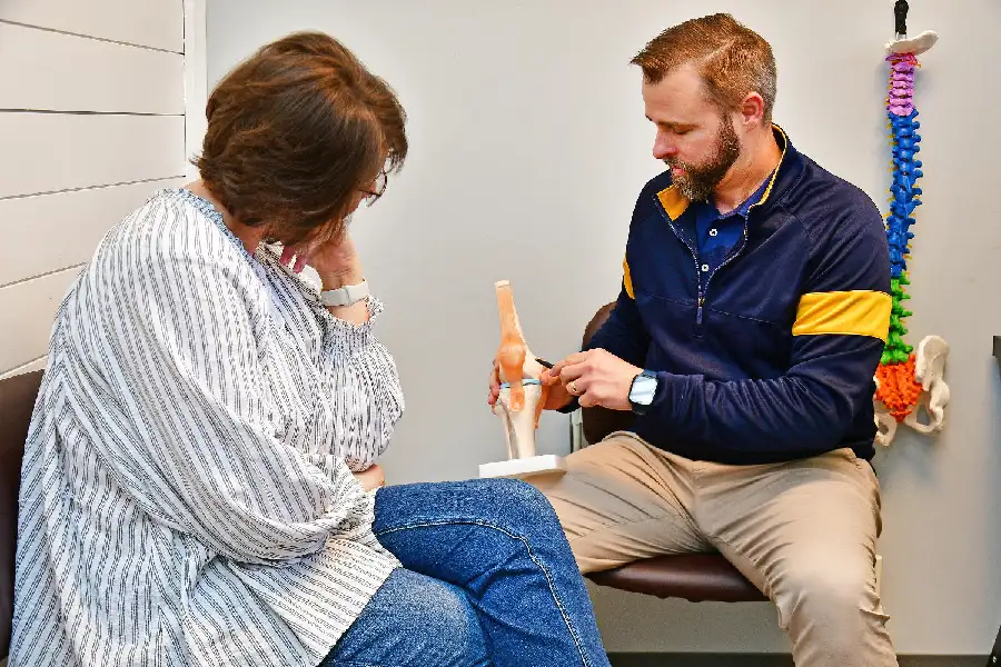 Dr. Shawn Curry with a patient - Chiropractor in Greenville, SC