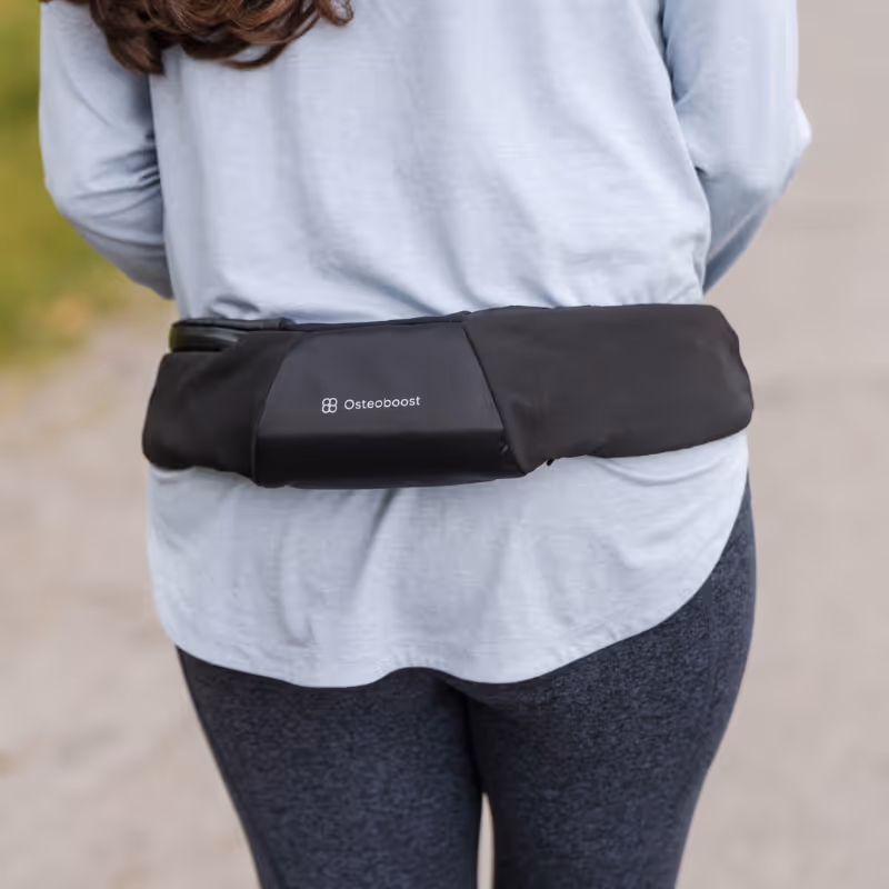 Close-up of Osteoboost wrapped around the waist of woman wearing athletic clothing