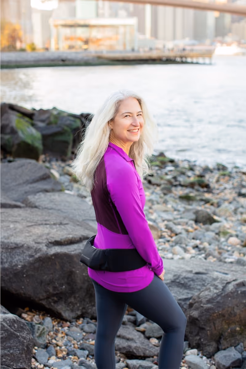 Woman wearing Osteoboost and standing by the water