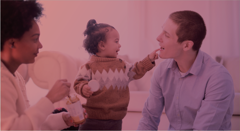 Mother and father playing with young toddler. Represents 1 in 2 children have a parent with a criminal record section. 