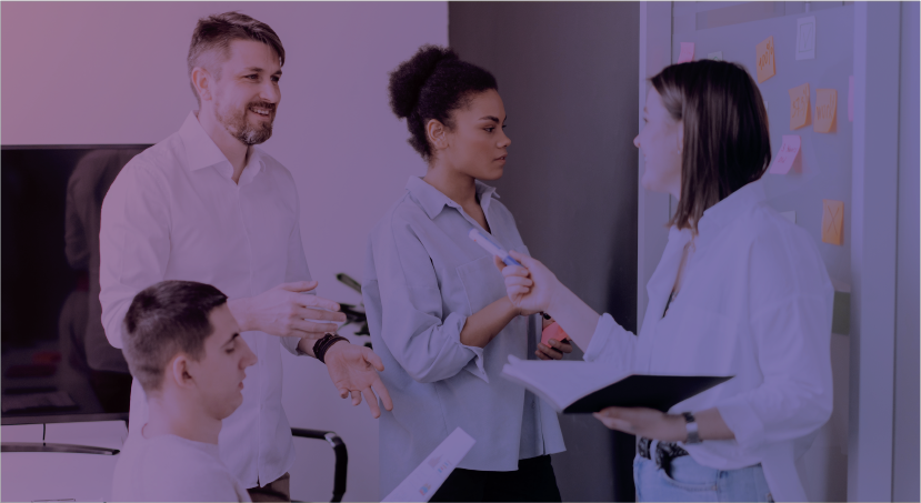 Group of four people working together in an office. Represents 90% of employers use a background check section.