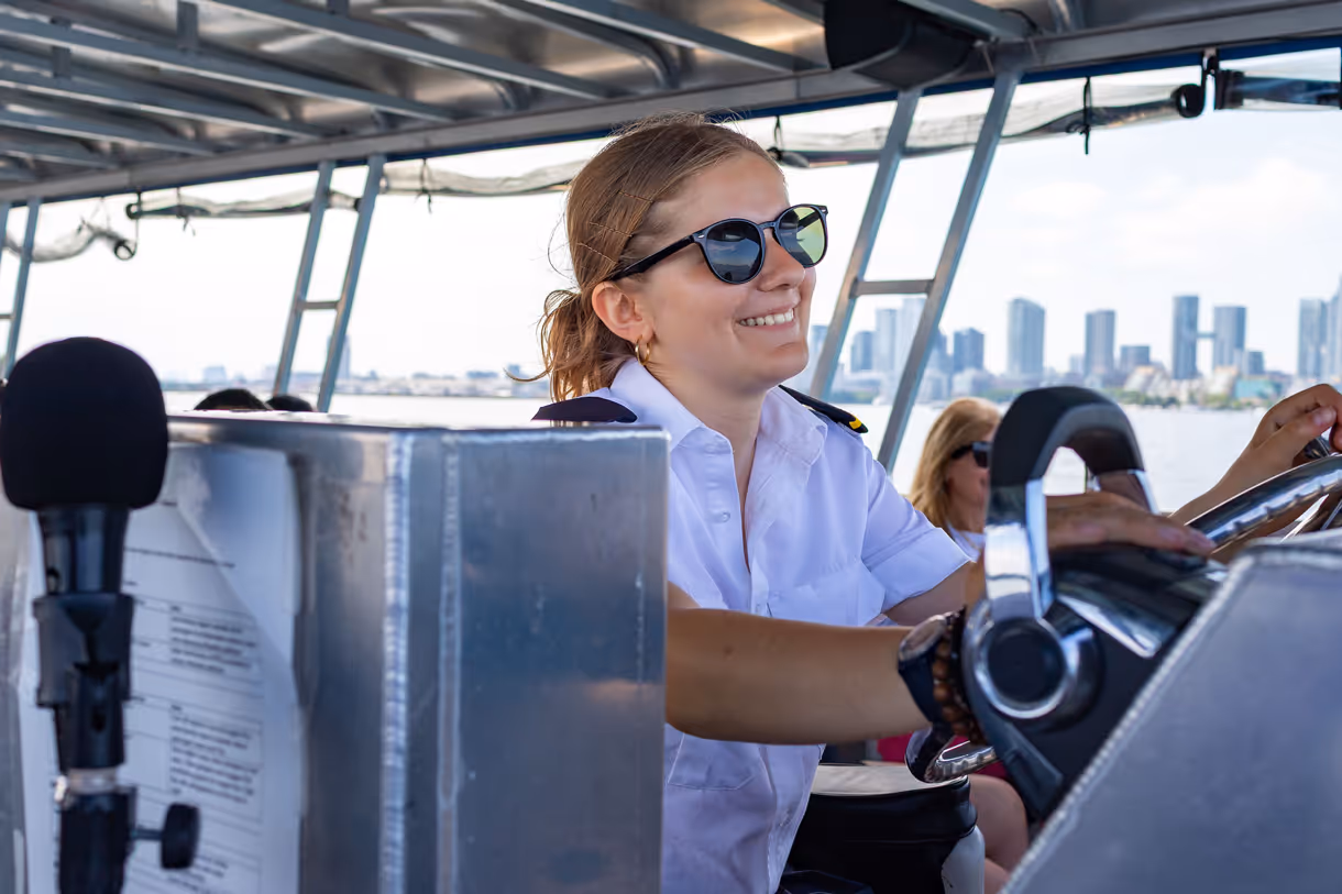 Girl with sunglasses driving the Triton
