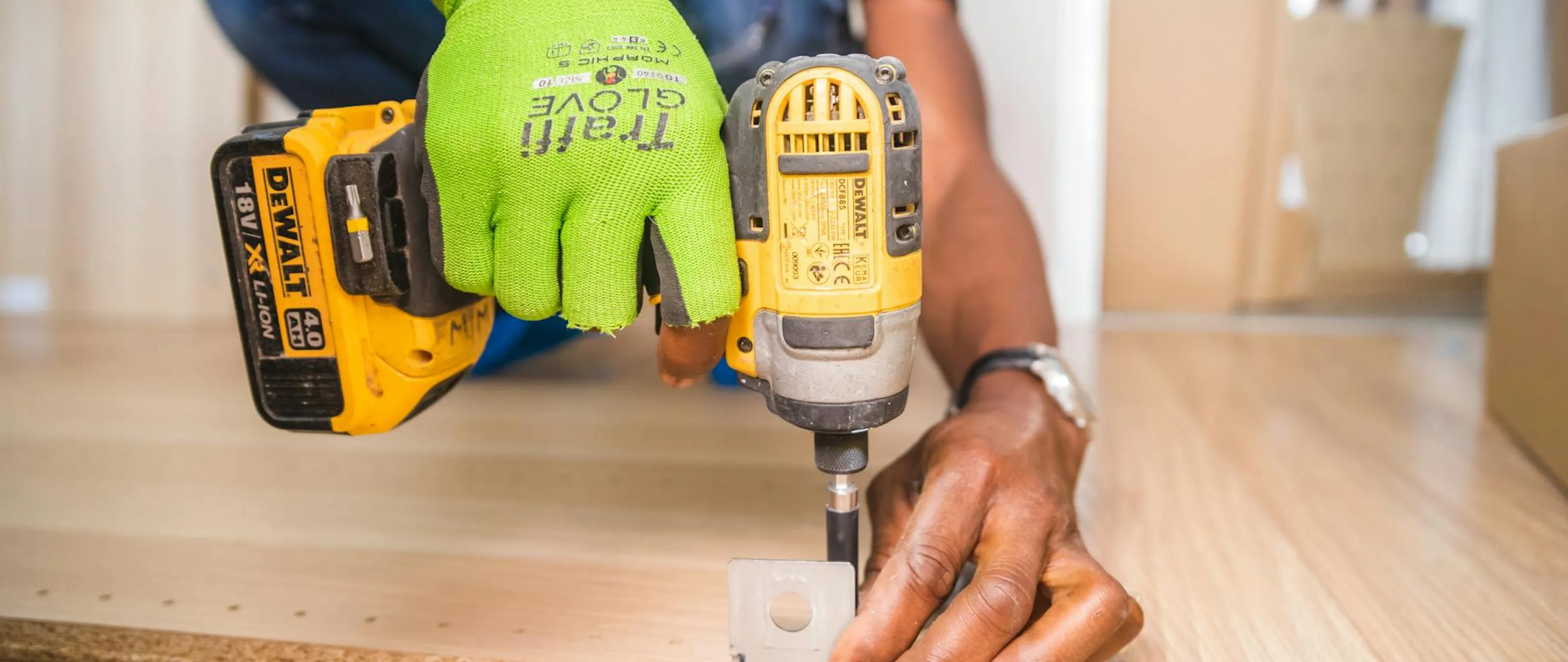 A PMB Property Improvements worker installing new flooring