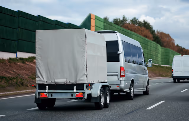 Minibus towing trailer on the motorway