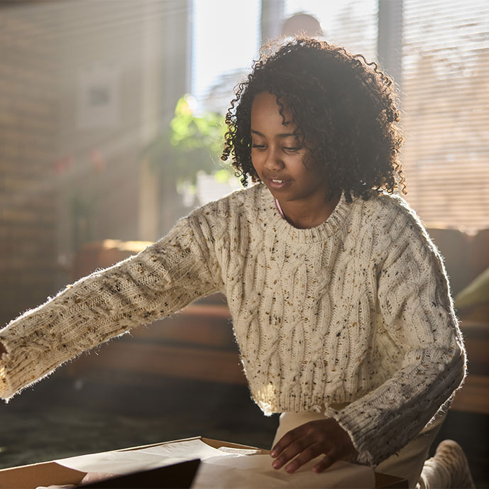 A girl opening a package