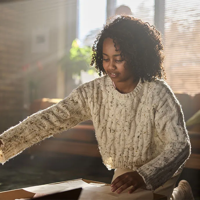 A girl opening a package