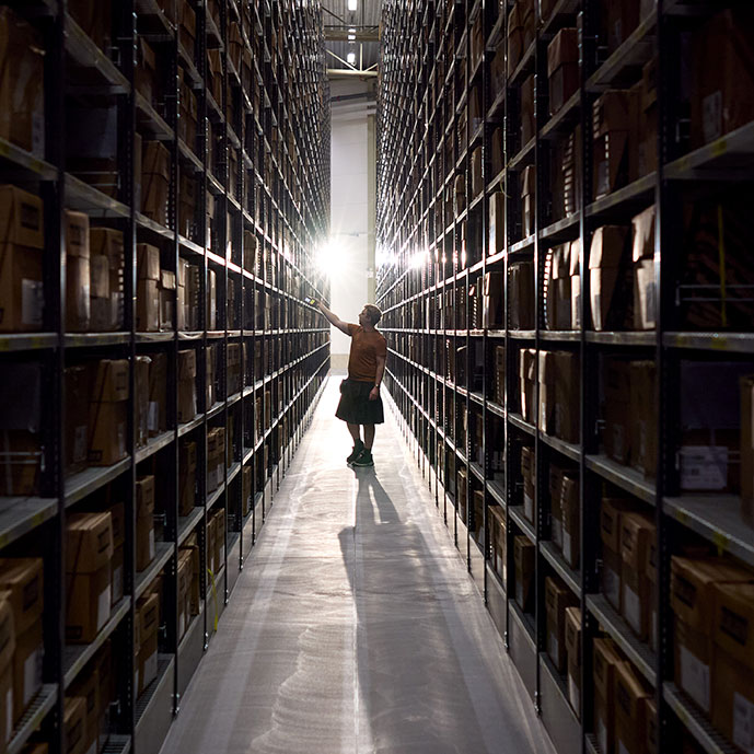 A man standing in a warehouse