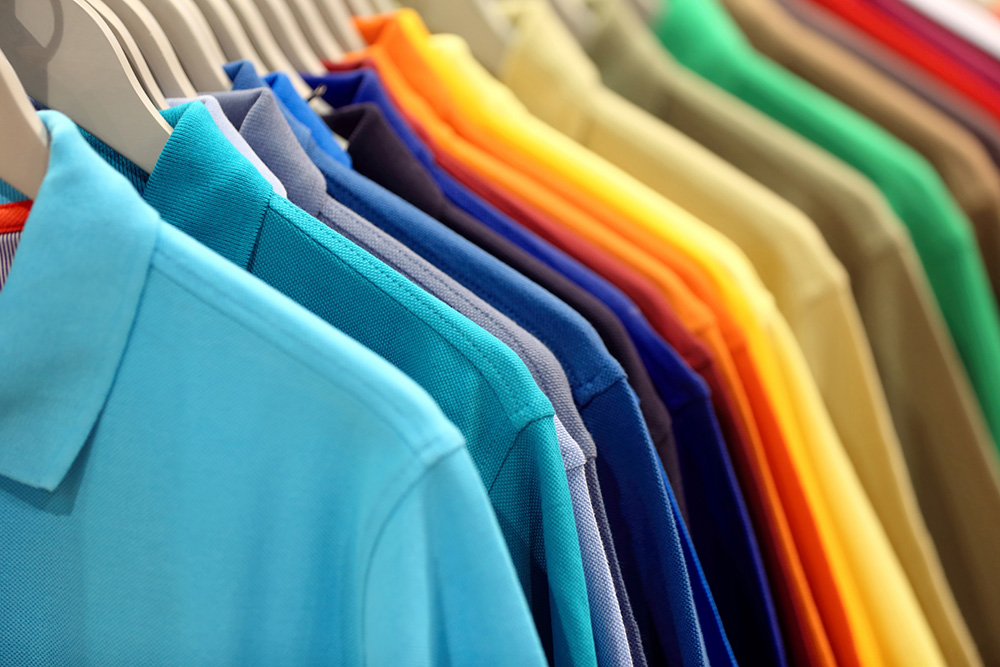 A range of polo shirts in different colours. 
