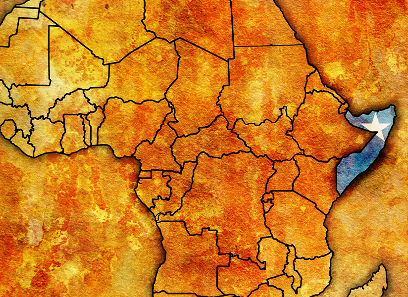 A textured map of Africa with Somalia highlighted in blue on the eastern coast.