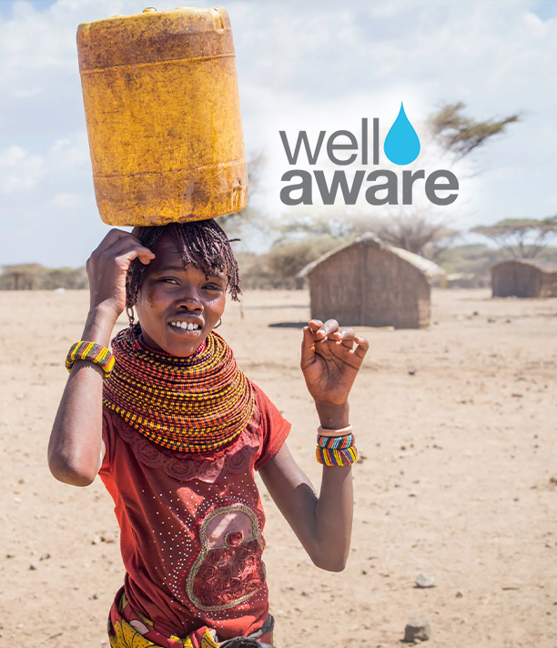 A smiling girl in beaded necklaces balances a yellow water container on her head in a dry village, beside the Well Aware logo.