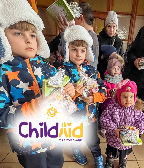 Young children in winter coats and hats hold small gifts, beside the ChildAid logo.