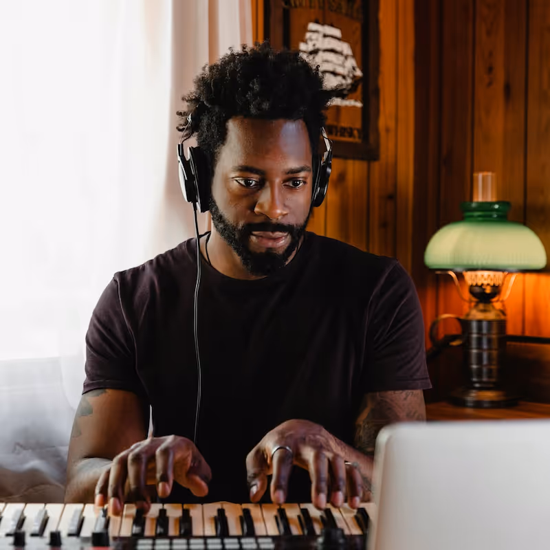 A man playing the synthesizer