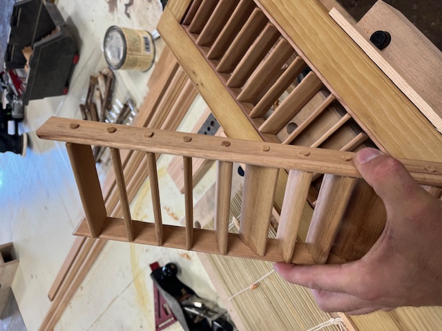Handcrafted wooden louvered shutters in woodworking workshop