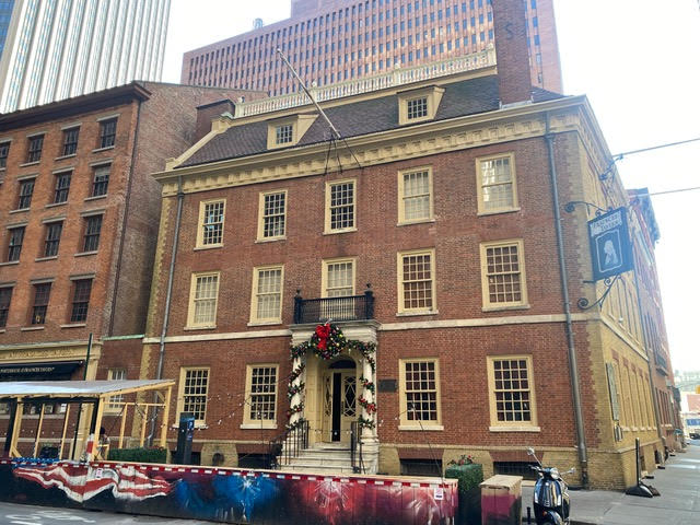 Historic landmark brick building with restored architectural features and decorative entrance