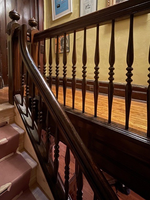 Wood stair handrail with turned balusters detail