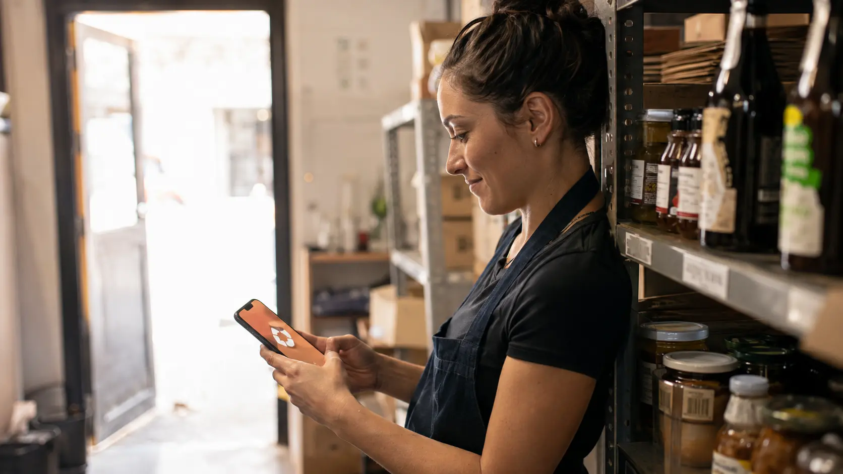 White label LMS opened on a smartphone by a frontline worker
