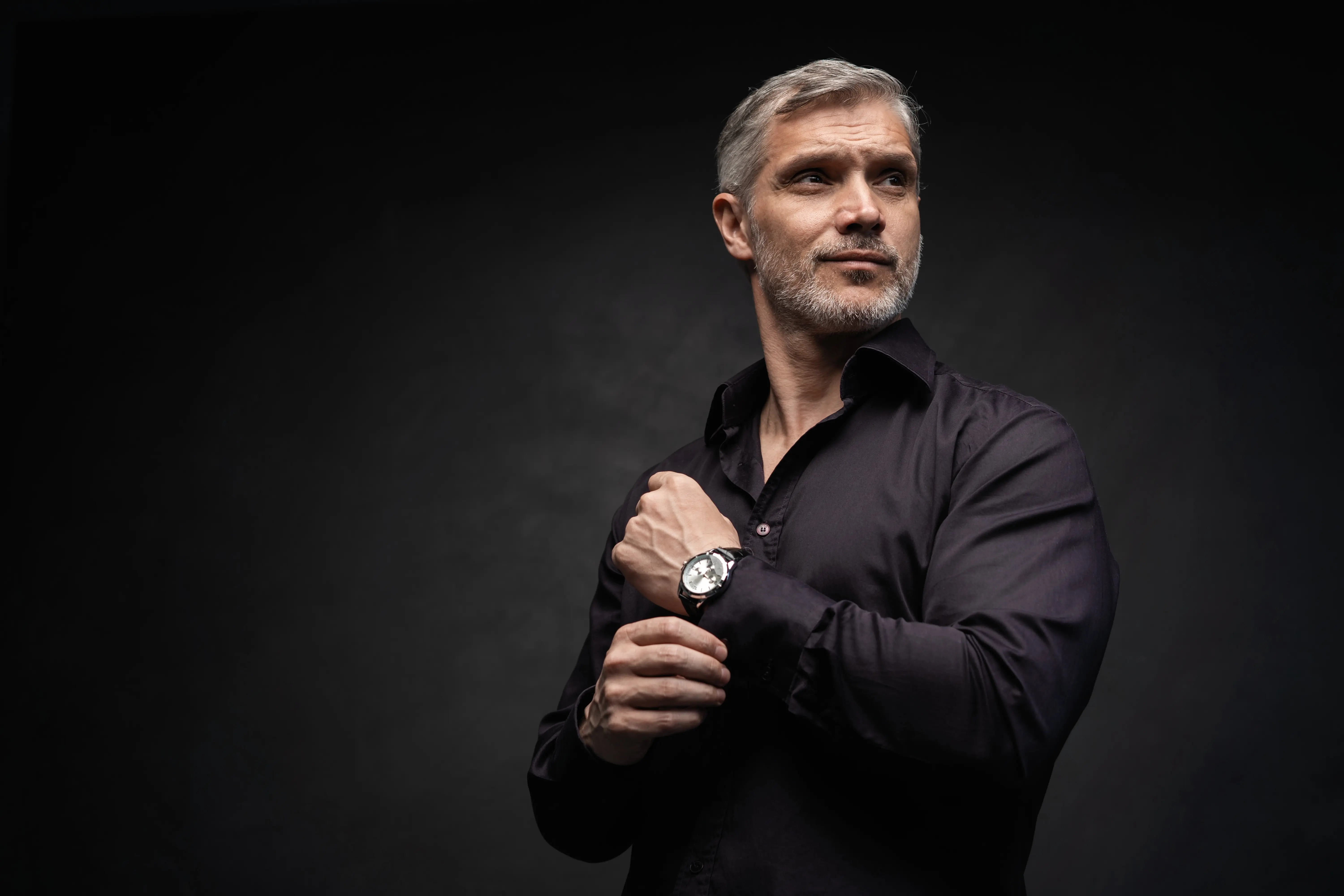 A man with a watch on his wrist.