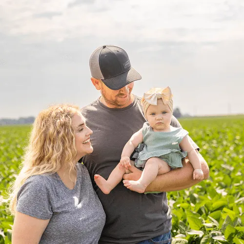 Family picture of a man, woman, and baby