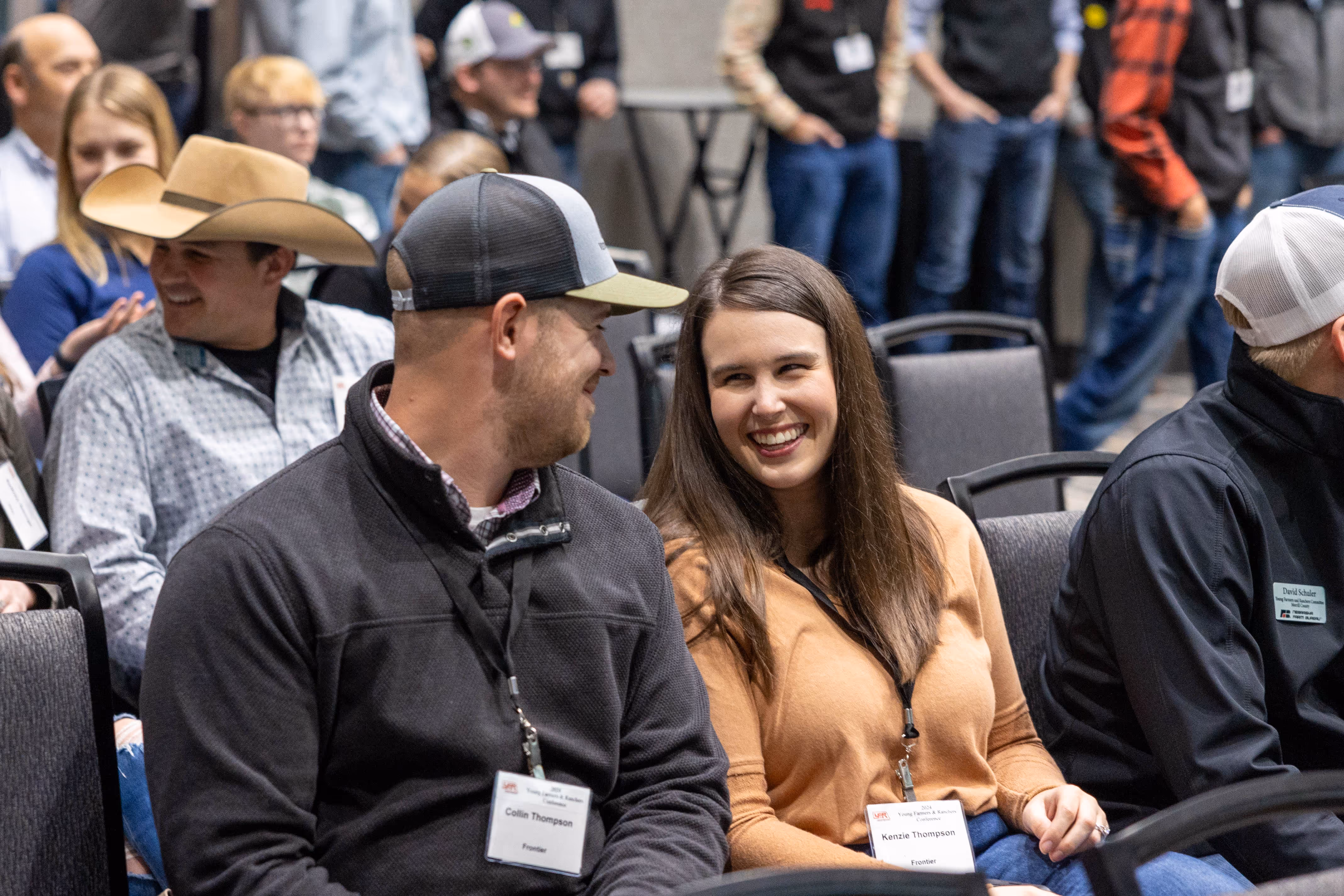 Man and woman sitting and smiling